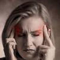 woman grimacing with headache